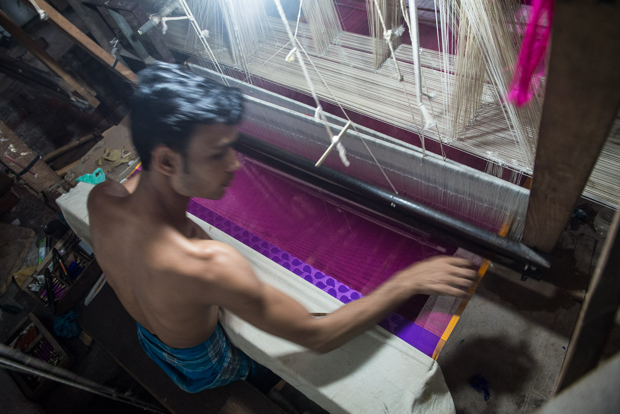 Young men weaving banarasi silk sarees in Varanasi